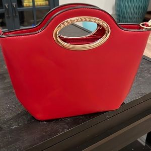 Red handbag with strap